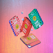 Four Flintts Mints tins — Strawberry Magic, Mint, Cinnamon Ginger, and Lemon — in a dynamic, floating layout for the wild-strength variety pack.