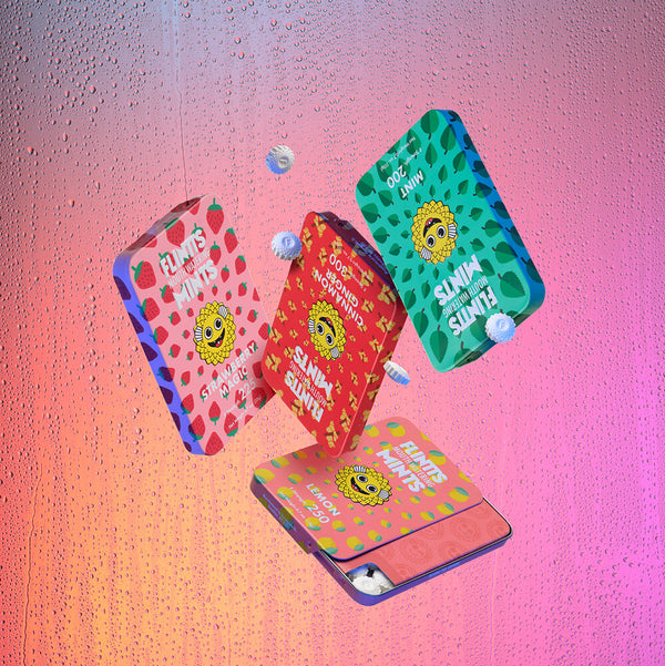 Four Flintts Mints tins — Strawberry Magic, Mint, Cinnamon Ginger, and Lemon — in a dynamic, floating layout for the wild-strength variety pack.