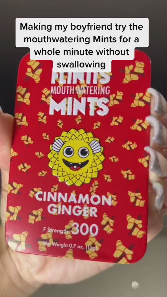 Close-up of a Flintts Cinnamon Ginger Mints tin, featured in a video challenge where someone tries the mints for a full minute without swallowing.