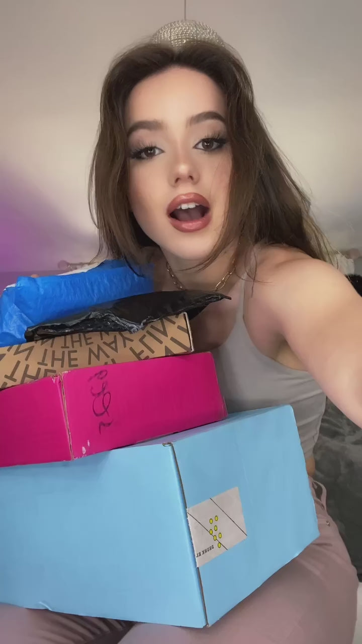 Opened Flintts shipping box showing a three-flavor Mild Pack with Lemon, Mint, and Cinnamon Ginger tins neatly displayed inside.