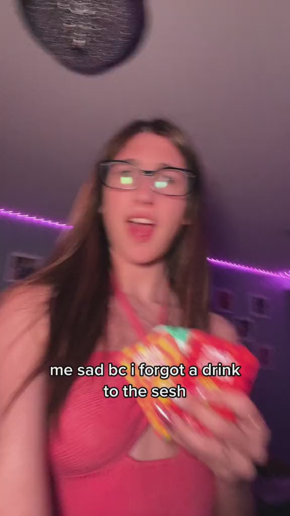 Smiling customer holding multiple Flintts Mints tins in various flavors, with on-screen text reading “remembering I have flintts mints to keep my mouth hydrated.”